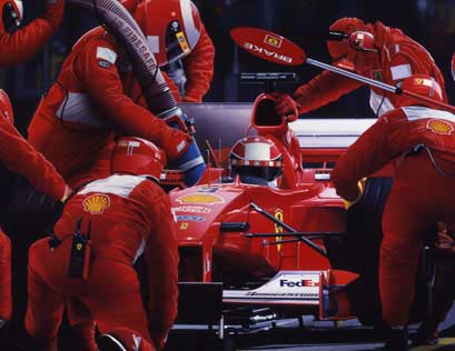 The Ferrari team undertake a pitstop at the 2000 United States Grand Prix at Indianapolis Motor Speedway. Michael Schumacher is the driver